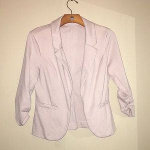 Pink blazer.